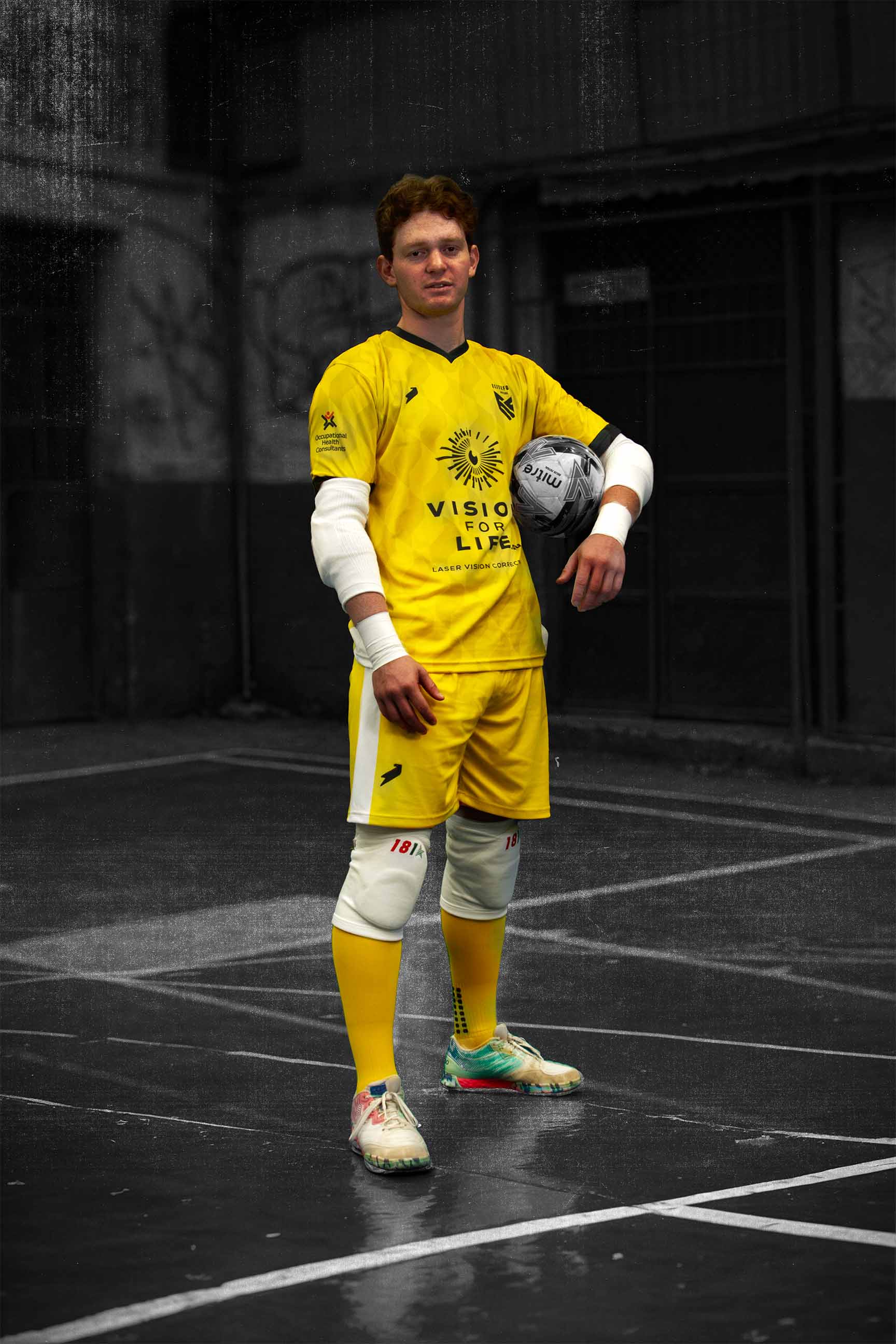 Male goal keeper looking at camera.